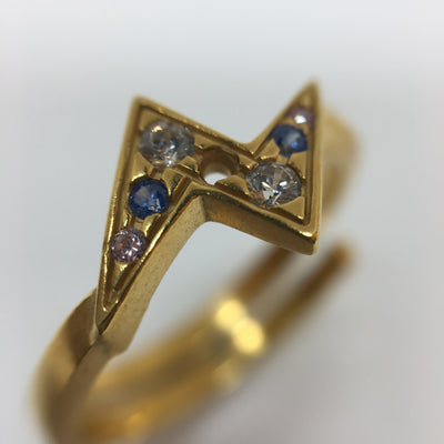 Golden flash ring with blue zirconias